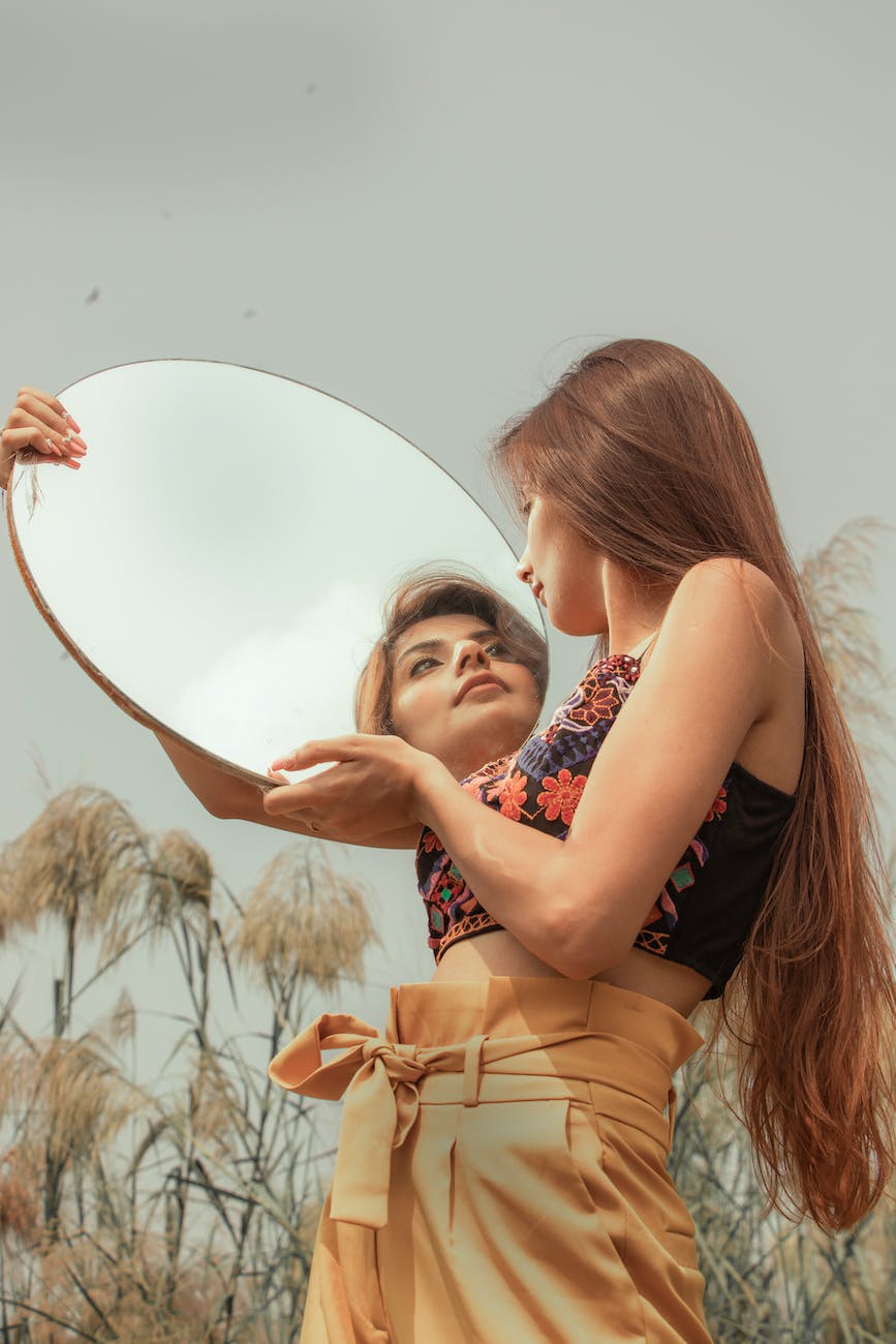 woman holding a mirror